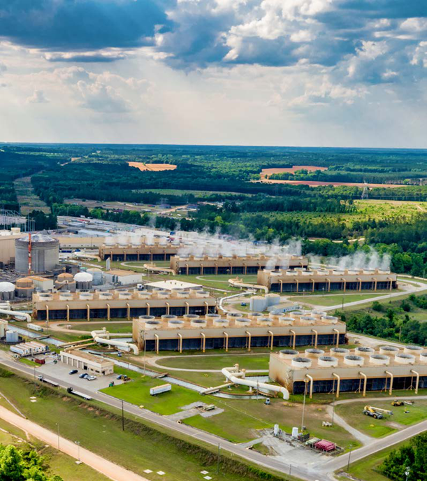 Aerial view of cooling towers venting steam waste heat to atmosphere at Farley Nuclear Power Plant.